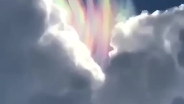 Rainbow multi coloured clouds hidden in the sky. 😱