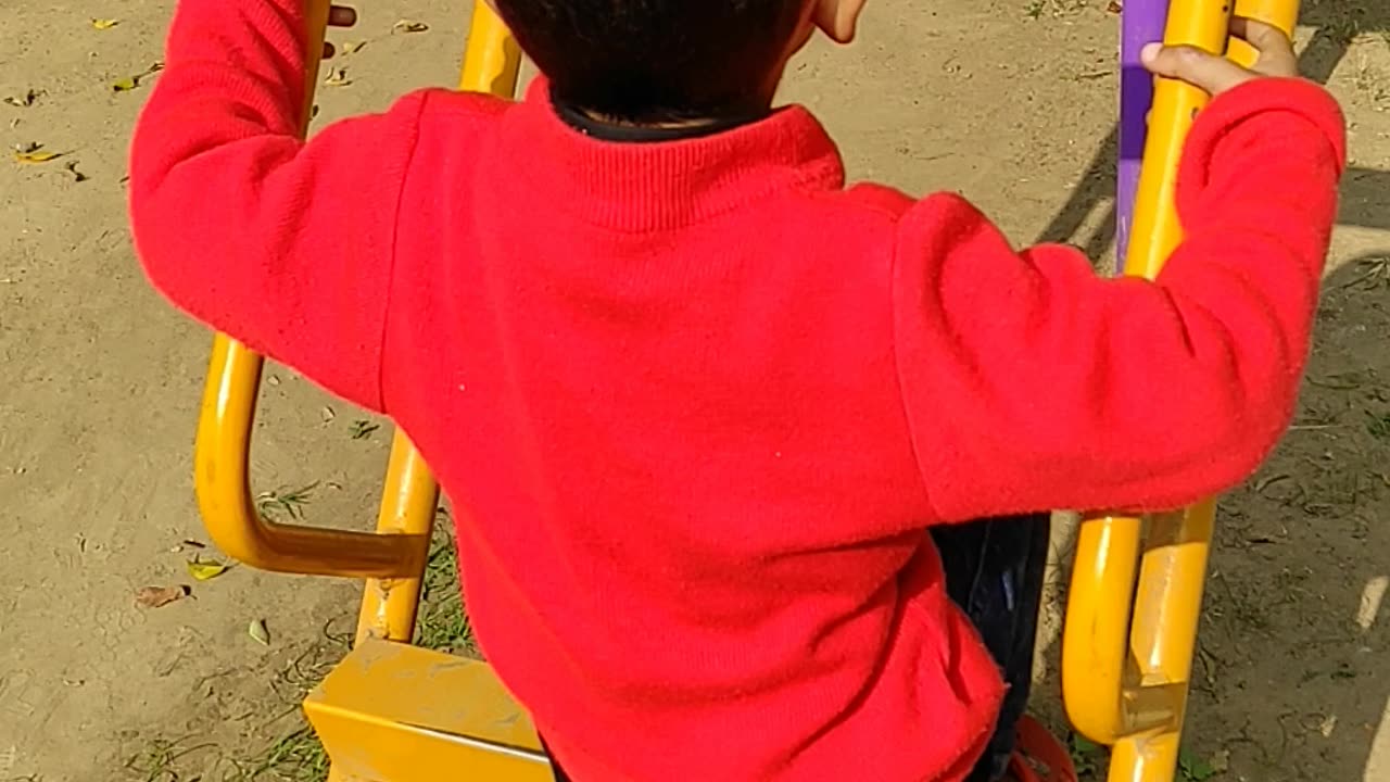 FUNNY CHID PLAYING IN GROUND