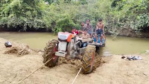 driver tractor go transport water at the river