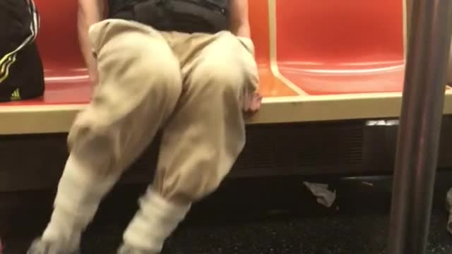 Rents to high old guy working out on train orange seats