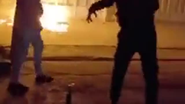 Iran, 🇬🇧In some places, protesters throw Molotov cocktails at government buildings.