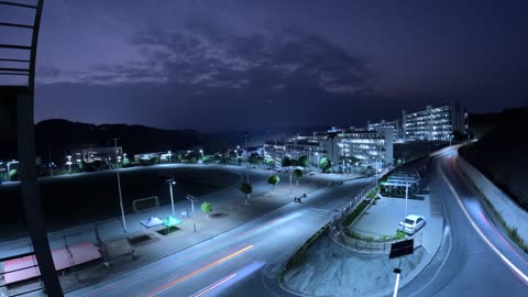 Traffic Flow night view urban free stock video. Free for use & download.
