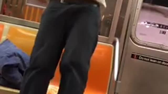 Wtf guy does pull ups on subway bar