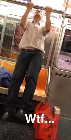 Wtf guy does pull ups on subway bar
