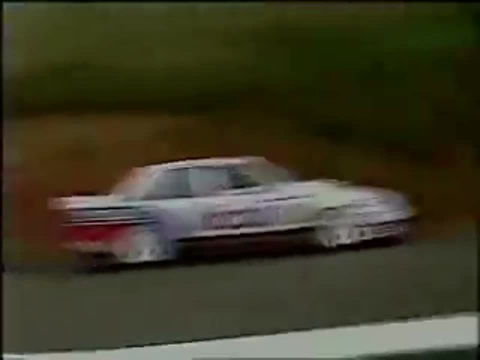 Peter Brock racing in the wet at Mount Panorama using dry weather tyres (1987)