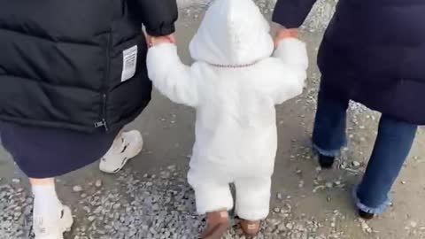 a Korean baby in bear clothes