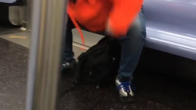 Woman in subway fighting the air