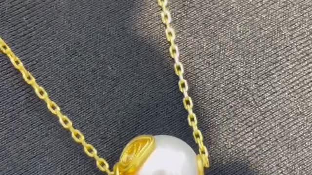 A necklace made of gold and pearls