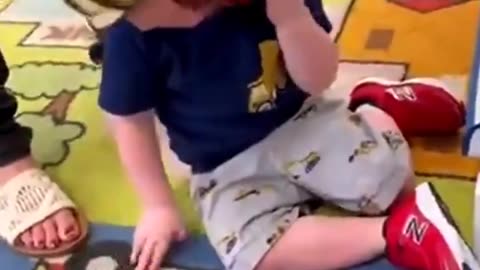 nazi indoctrinated parents torturing little kid with mask.