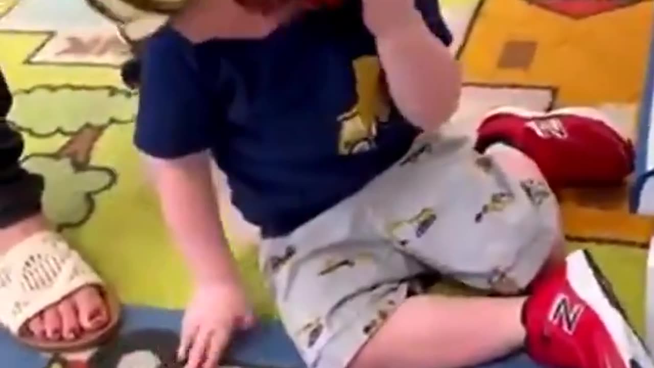 nazi indoctrinated parents torturing little kid with mask.