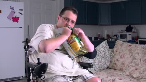 Quadriplegic opening a bag of chips