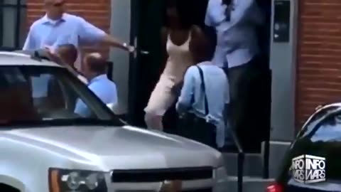 Michelle Obama leaving townhouse and touching herself