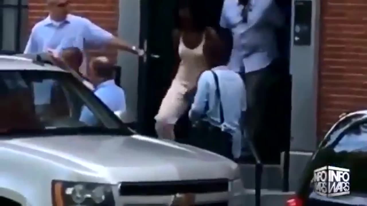 Michelle Obama leaving townhouse and touching herself