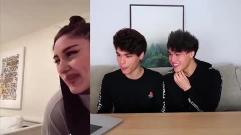 Twins laugh at each other at tiktok videos