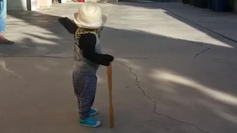 This awesome toddler is a complete gentleman with his hat and "cane" and it's adorable