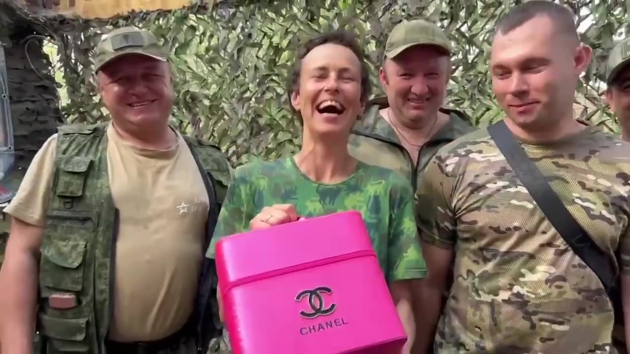 Russian Solders Present Propaganda Singer with Looted Purse