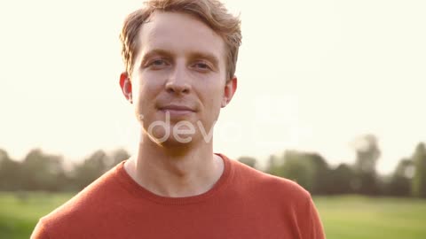 Portrait Of A Man Smiling And Looking At Camera In The Park 1