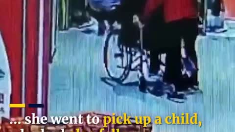 Woman in China saves elderly man in wheelchair from rolling down escalator, wins praise online