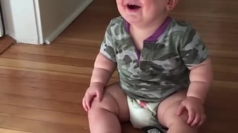 Hilarious laughing by cute baby