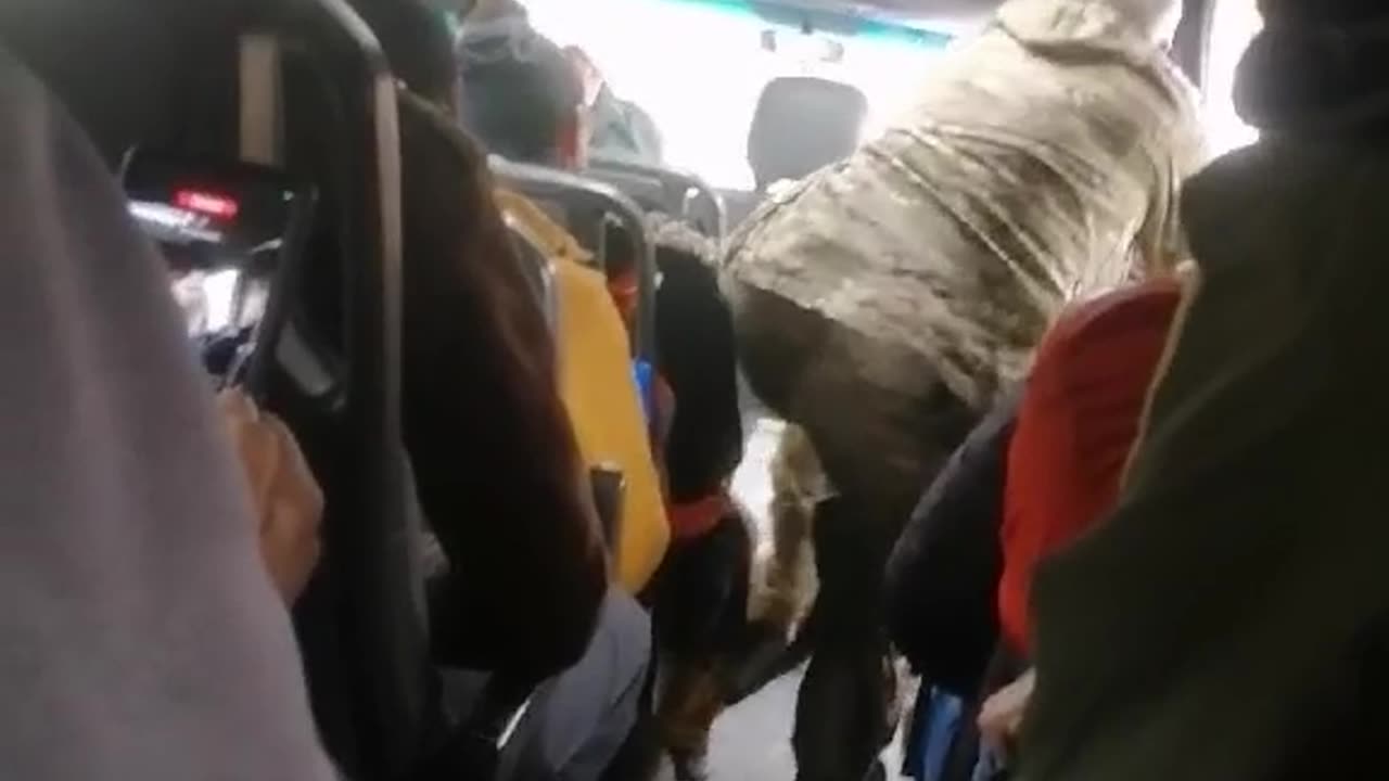 The Ukrainian is so eager to go to the front that the military officer has to calm him down.