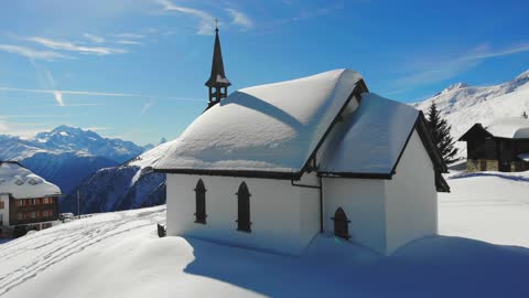 A Drone Shot of a Church in Belalp