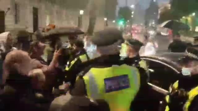 Protesters stop car from entering London's Downing Street shouting