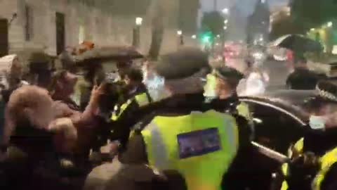 Protesters stop car from entering London's Downing Street shouting