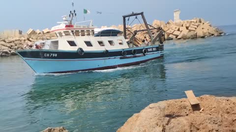 Fishing Boat Entering The Harbour