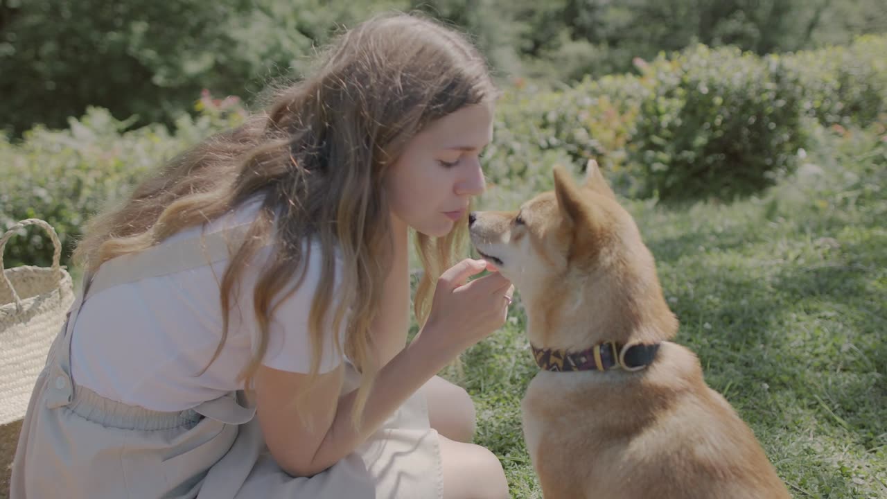 Girl kissing her Dog