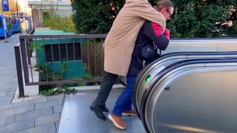 Boys Turn Heroes for Elderly Woman on Escalator
