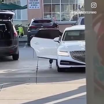 Thieves steal luggage from a car trunk as the owner pumps gas at a gas station in Oakland, CA