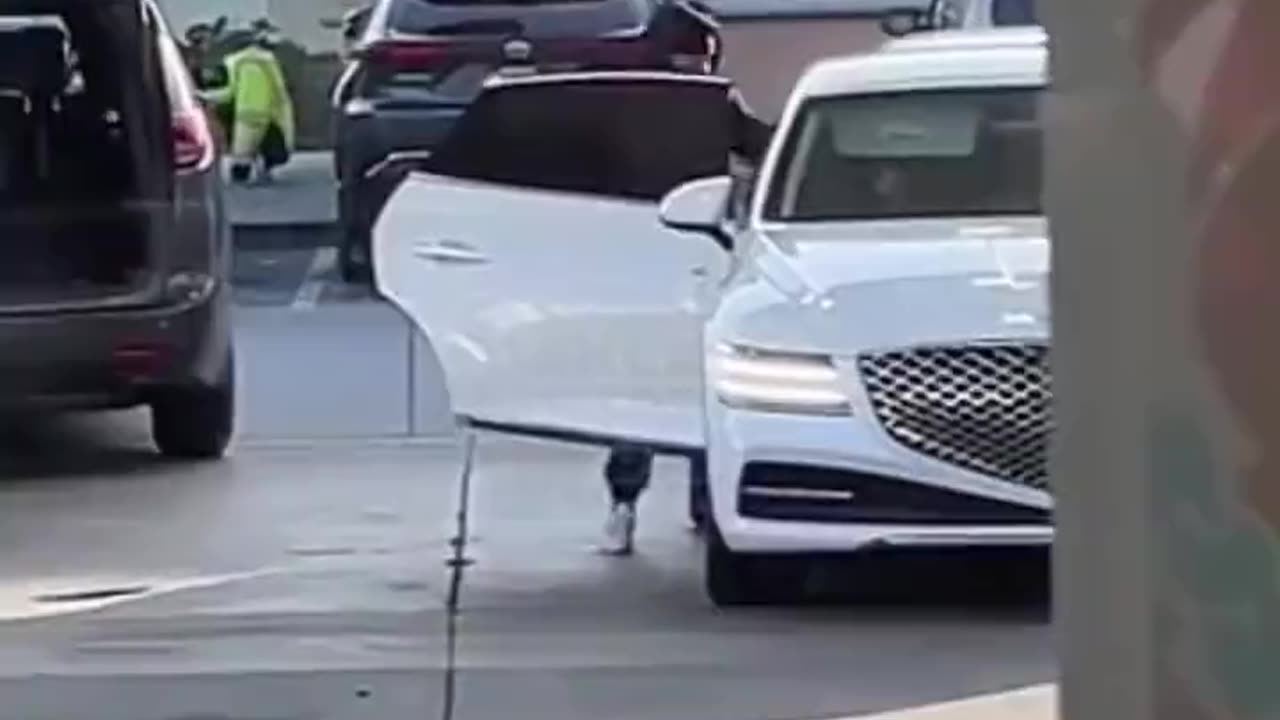 Thieves steal luggage from a car trunk as the owner pumps gas at a gas station in Oakland, CA