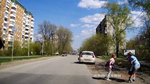 Girl Runs Into Street , Barely Missed By Car