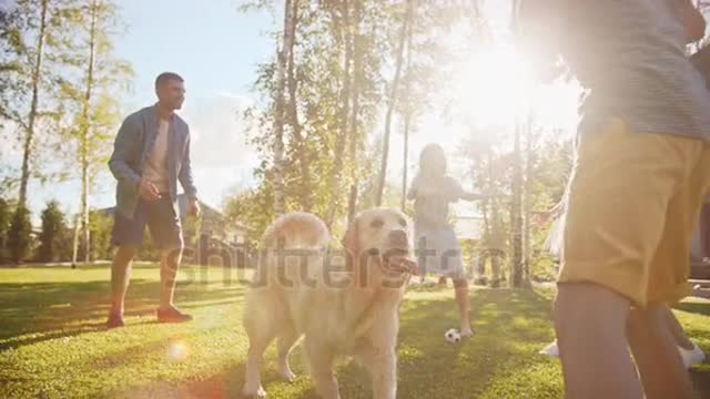 Beautiful Family Playing With Their Dog