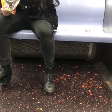 Drunk girl on subway eats hot cheetos off floor