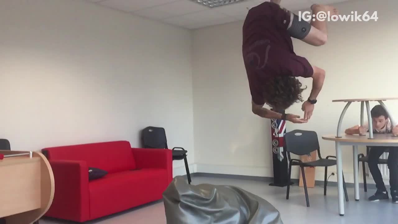 Slowmo guy frontflips onto small bean bag