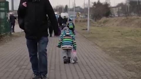 UKRAINE BOY WITHOUT HIS PARENTS AMIDST OF BATTLE.