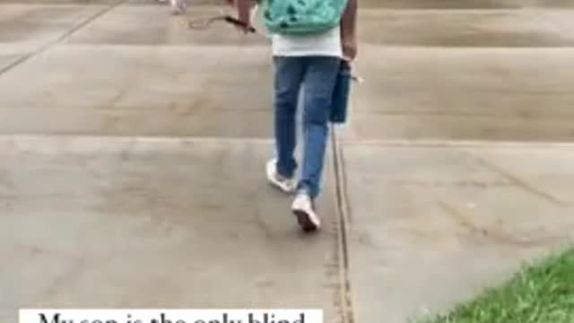 Blind student enthusiastically finds way around school on his first day