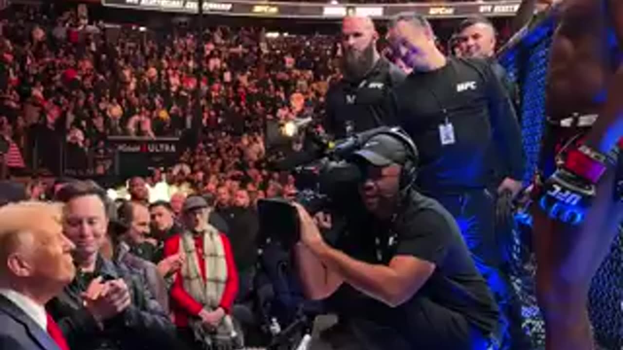 After winning, UFC fighter Jon Jones hands over his championship belt to President-elect Trump.