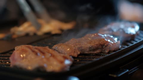 ASMR grilling meat on grill