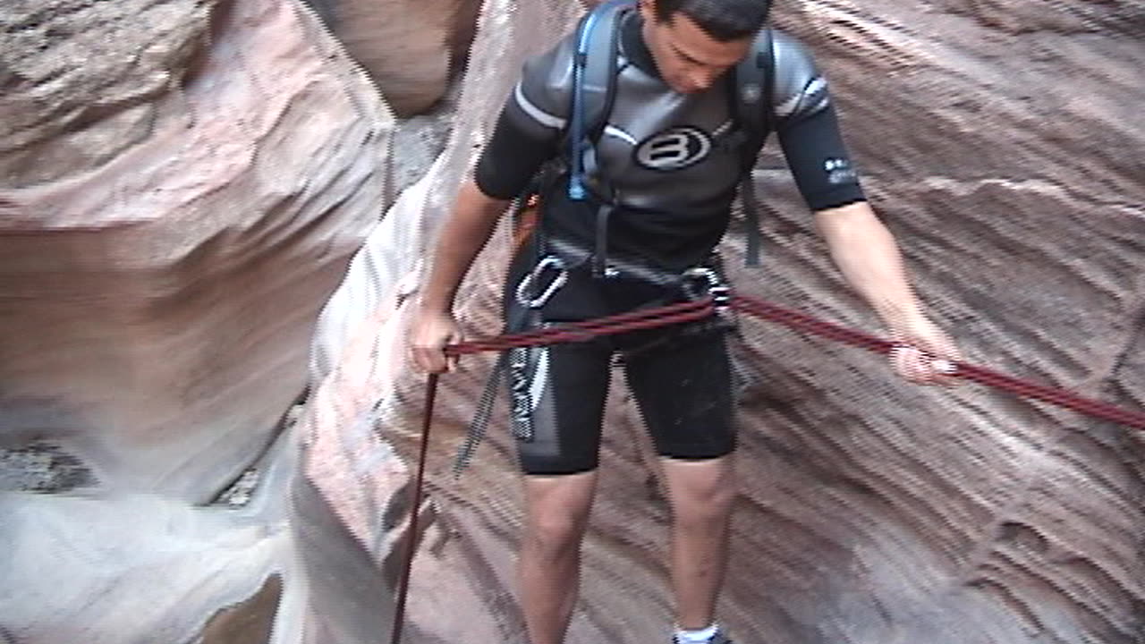 Brian and Brittany rappelling the last big rappel in Pine Creek Canyon