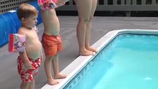 Child Does a Spectacular Belly-Flop into the Pool