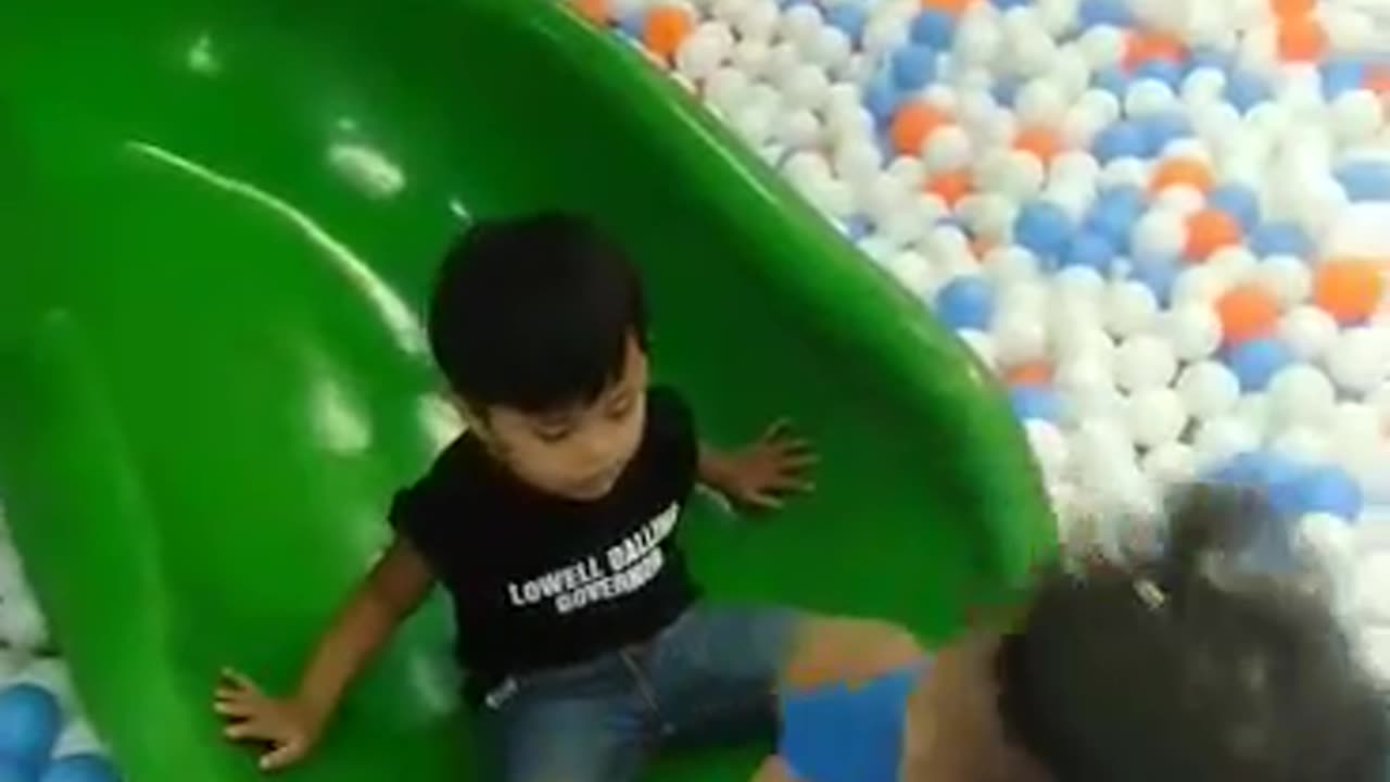 Children funny slide and throwing ball