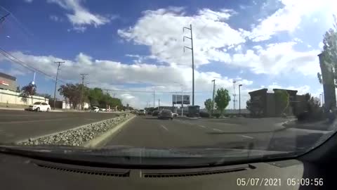 The tire of the car almost hit the windshield