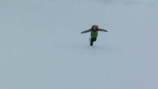 Girl riding alone on a snow rink