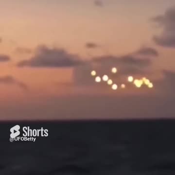 Group of Glowing UAPs hover over open Ocean