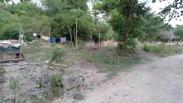 WALKING THE HOUSING AREA AROUND BRIDGE AT NAGUILIAN LAUNION