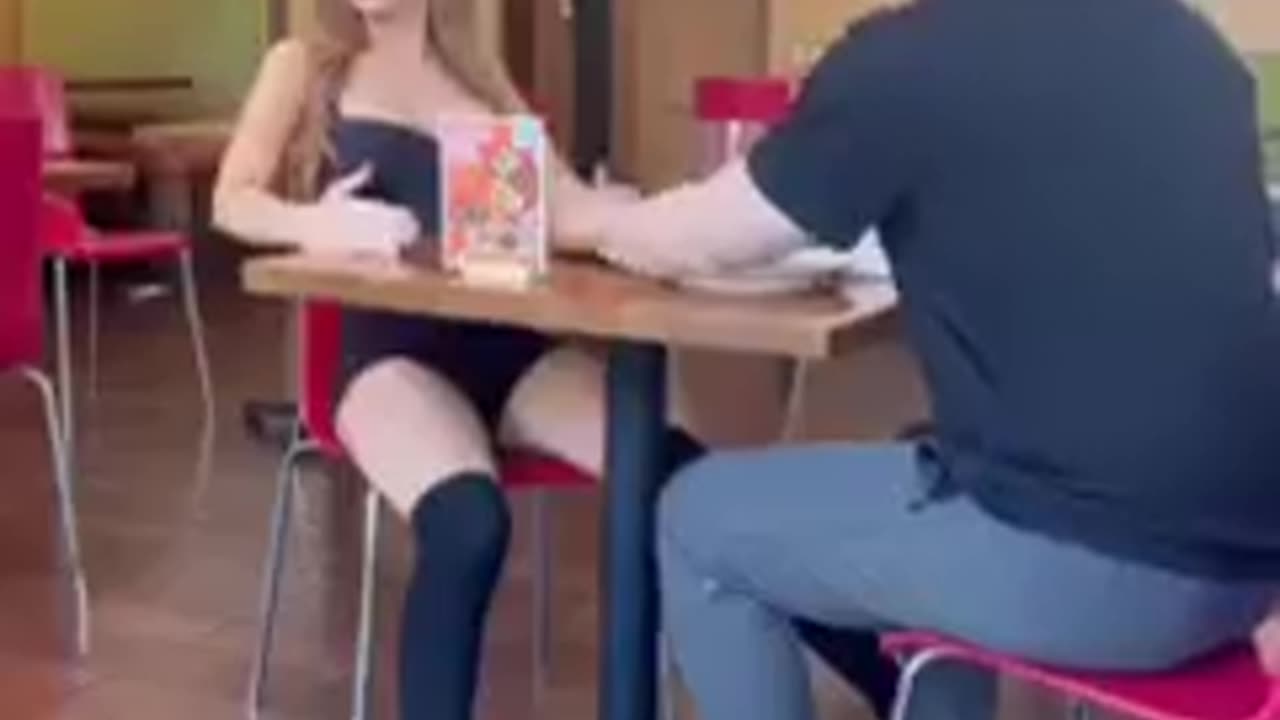 Taking his doll out on a date... and feeding 'her' too..