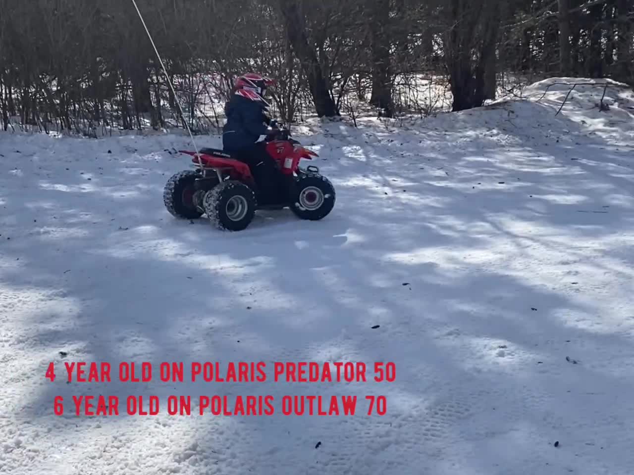 Kids riding 4 wheelers in snow