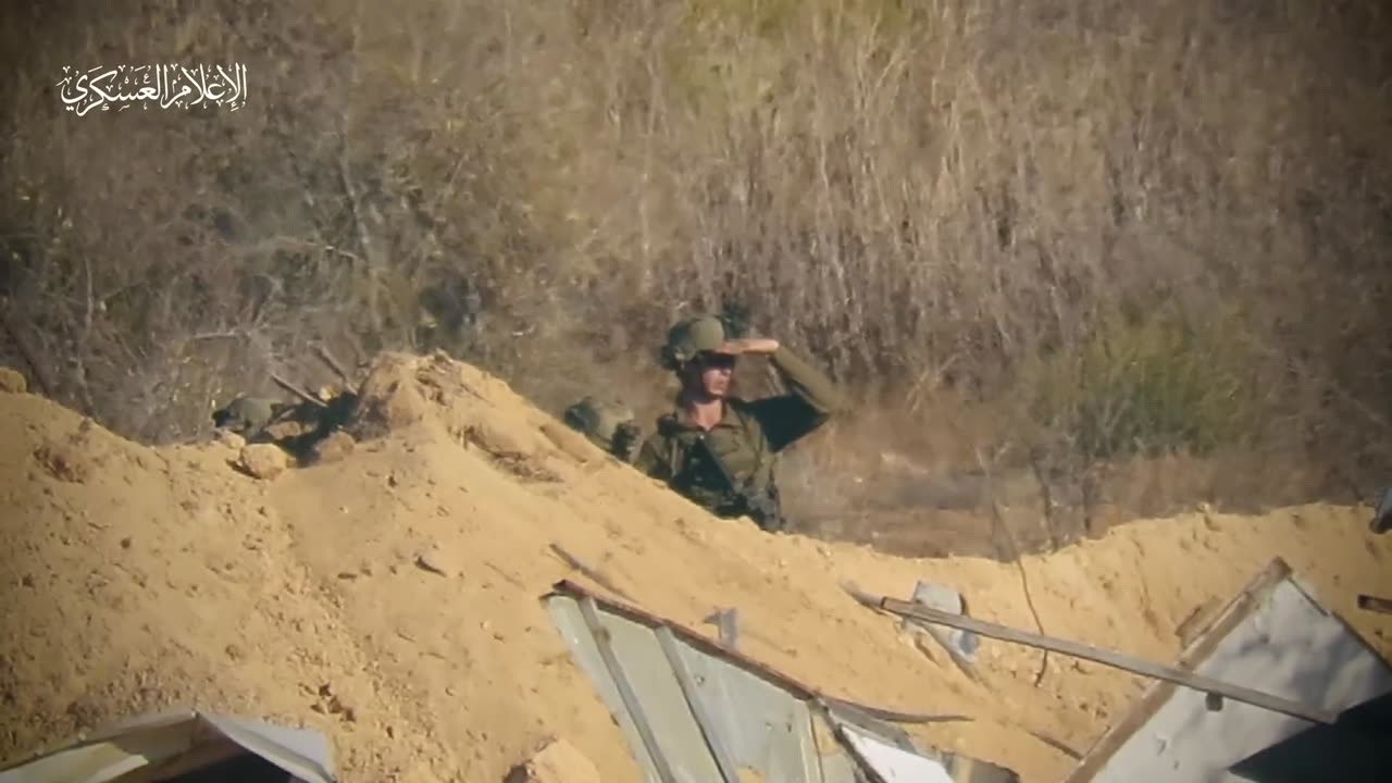 A Zionist officer sniper, in conjunction with the Al-Quds Brigades